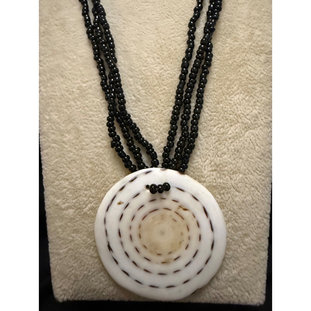 Vintage Multi Strand Black Seed Bead Necklace Large Sliced Shell Spiral Pendant